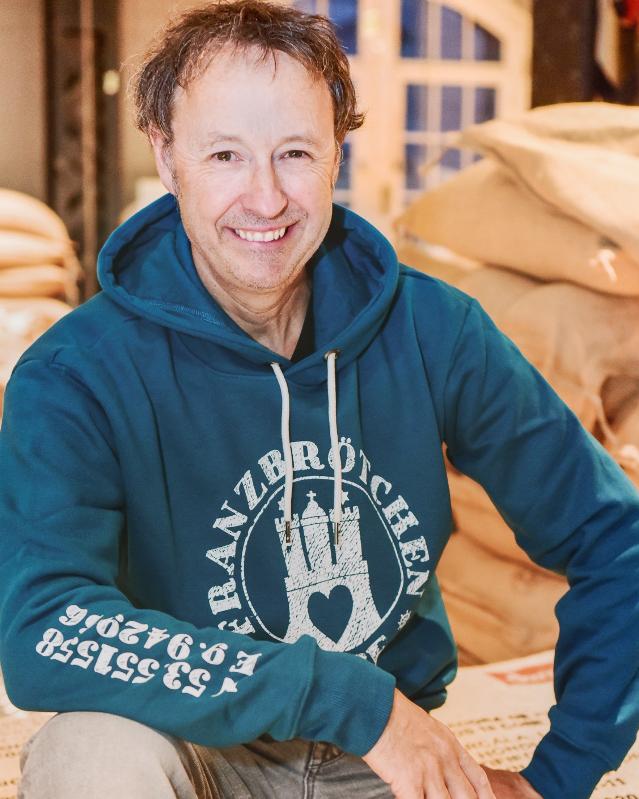 Franzbrötchenliebe Hoodie unisex - Lyons Blue türkis mit weißem Print Franzbrötchenliebe Hoodie unisex - Lyons Blue türkis mit weißem Print